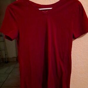 A maron v neck tee shirt